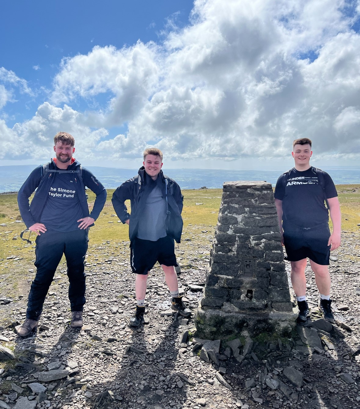 three team members on one of the three yorkshire peaks